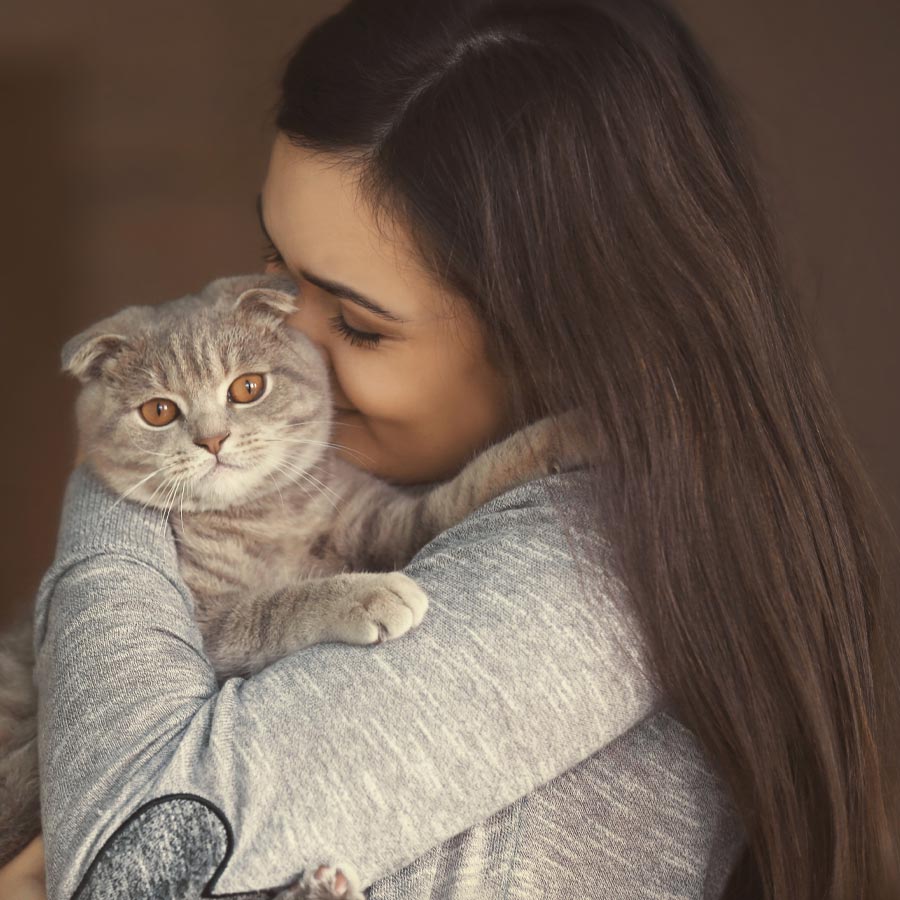 Woman Snuggling Cat