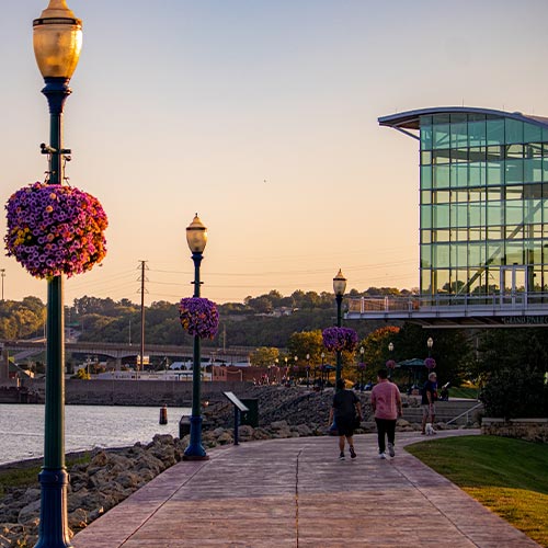 people on riverwalk by Mississippi River in Dubuque